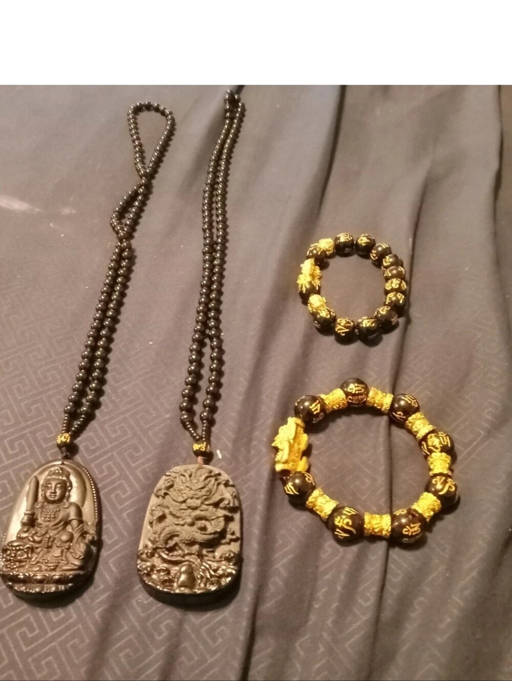 Gold and Black Buddhist Beaded Bracelets and Black Pendant Necklaces